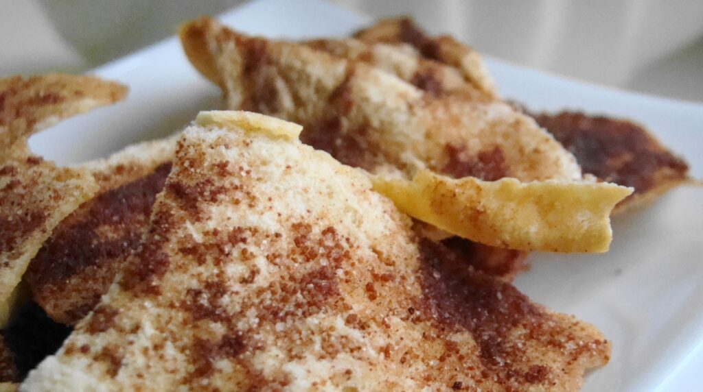 Macro close-up of crinkly spiced pumpkin snickerdoodle cookies dusted with sparkling cinnamon sugar